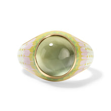 Load image into Gallery viewer, A gold signet ring featuring a large, bezel set oval green prehnite cabochon gemstone, with a tapered band decorated in a pastel pink and green patterned enamel design, set against a clean white background.