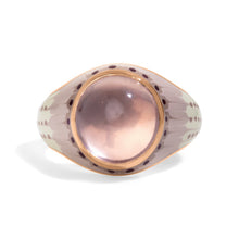 Load image into Gallery viewer, A vintage-style 14K yellow gold signet ring featuring a large oval pink rose quartz cabochon gemstone in a gold bezel, with a patterned white enamel band decorated with tie-dye.